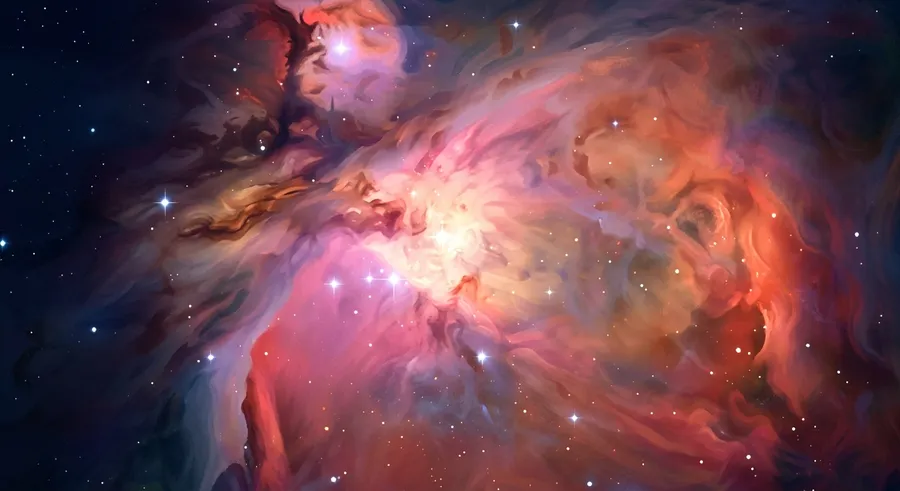 A glowing nebula of gas and dust where new stars are forming